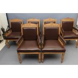 A SET OF SIX VICTORIAN LIMED OAK ELBOW CHAIRS upholstered in brown leather, padded back with
