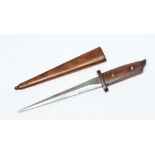 A FIRST WORLD WAR GERMAN FIGHTING KNIFE with 7 1/8" double edged tapering blade, steel cross