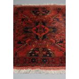 A CAUCASIAN CHELABERD RUG, modern, the bold central cruciform medallion with flowerheads in navy