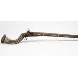 AN AFGHAN MUSKET with 46 1/2" octagonal barrel, flintlock action with East India Company heart mark,