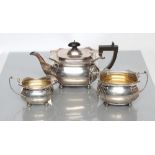 A SILVER THREE PIECE TEA SERVICE, maker Martin, Hall & Co., Birmingham 1922, of canted oblong