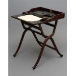 A MAHOGANY FOLDING CAMPAIGN DESK, early/mid 19th century, with fitted leather lined interior, raised