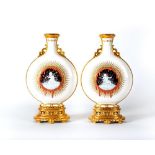 A PAIR OF DOCUMENTARY MINTON PORCELAIN PATE-SUR-PATE MOON FLASKS, 1884, of typical form with Chinese