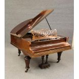A LIPP & SOHN WALNUT BOUDOIR GRAND PIANO, c.1900, with pierced fret music stand raised on faceted