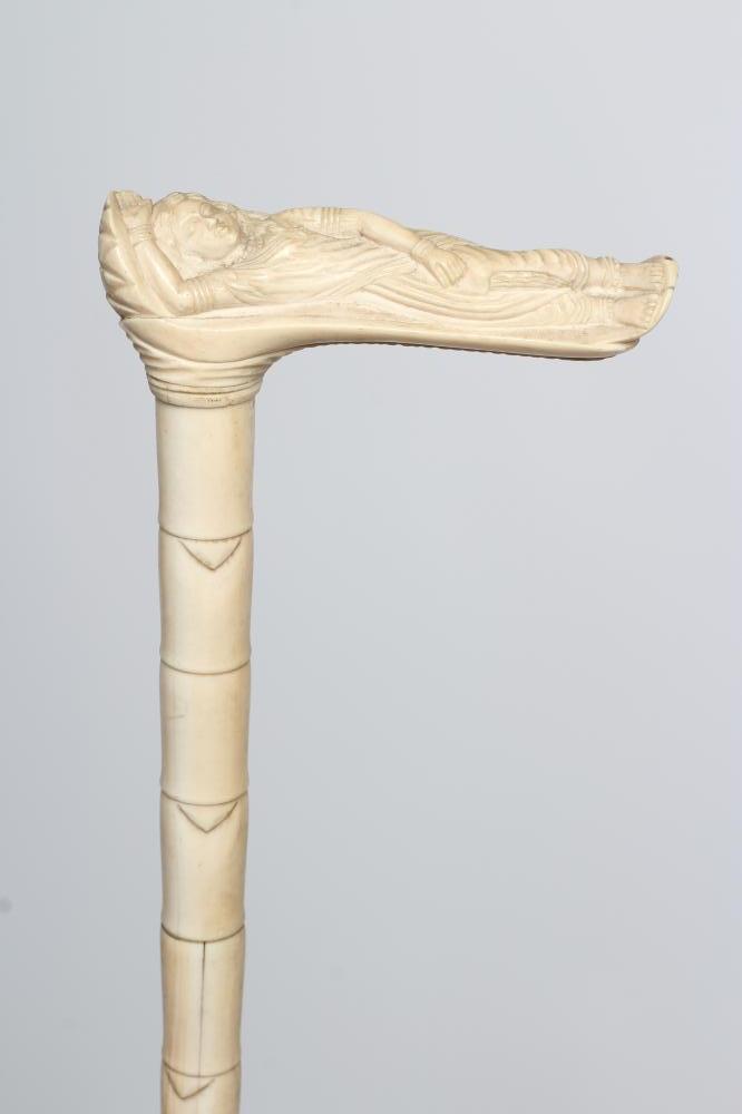 AN ANGLO-INDIAN SECTIONAL IVORY WALKING STICK, 19th century, the handle carved as a reclining female
