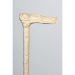 AN ANGLO-INDIAN SECTIONAL IVORY WALKING STICK, 19th century, the handle carved as a reclining female