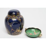 A CARLTONWARE GINGER JAR AND COVER, 1920's, painted in typical jewelled enamels and gilt with the