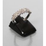 A DIAMOND HALF HOOP RING set with six marquise cut small stones with five pairs of small round