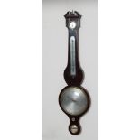 A MAHOGANY FOUR GLASS WHEEL BAROMETER by Jeremiah Giscava, with silvered registers and
