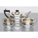 A SILVER THREE PIECE TEA SERVICE, maker Jones & Crompton, Birmingham 1912, of plain rounded oblong