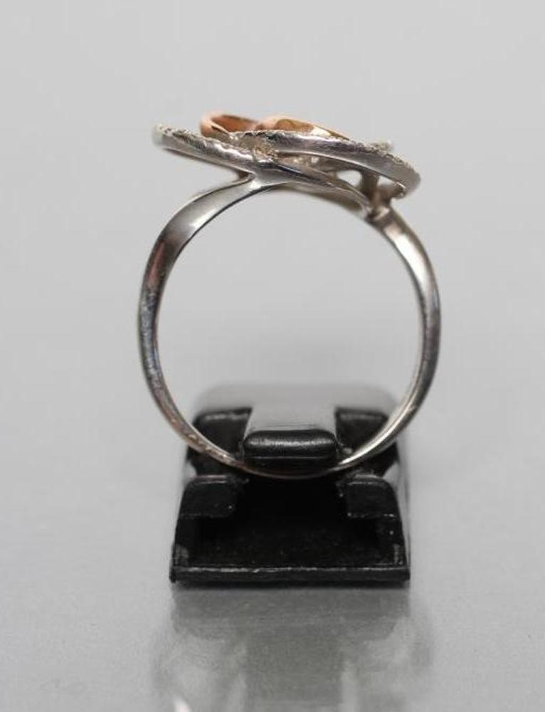 A DIAMOND DRESS RING, the open trefoil two tone gold swirl point set with numerous small round - Image 3 of 3