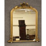 A VICTORIAN GILT WOOD AND GESSO PIER GLASS, the arched plate within a moulded frame with Prince of