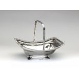 A LATE GEORGE III SILVER BASKET, maker Thomas Robins, London 1804, of dished rounded oblong form