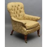 A VICTORIAN WALNUT FRAMED ARMCHAIR of spoon back form, button upholstered in green silk, padded