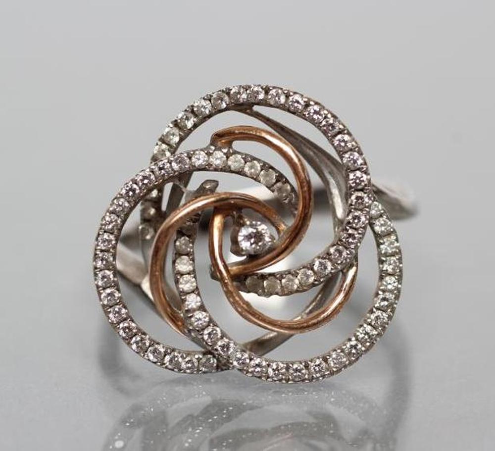 A DIAMOND DRESS RING, the open trefoil two tone gold swirl point set with numerous small round - Image 2 of 3