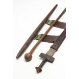 AN NORTH AFRICAN TUAREG TAKOUBA SWORD with 29 1/8" double edged blade, leather hilt and scabbard,
