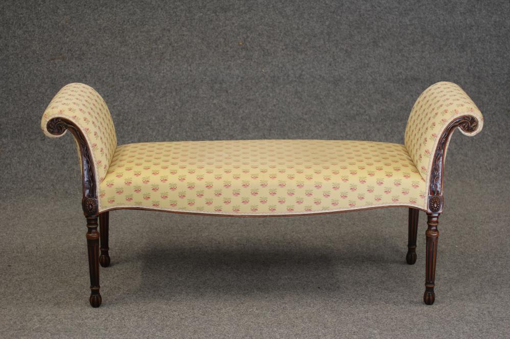 AN ADAMS STYLE CARVED MAHOGANY WINDOW SEAT, modern, upholstered in a yellow floral weave, scrolled