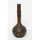 A JAPANESE BRONZE VASE of baluster form with lappet cast neck and girdled base with panels of