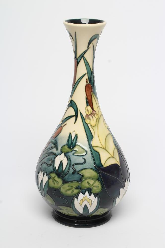 A MOORCROFT POTTERY BOTTLE VASE, modern, tubelined and painted in colours with water lilies, green