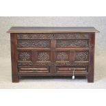 AN OAK PANELLED CHEST, late 17th century, the hinged plank lid opening to interior with till, the
