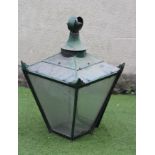 A VICTORIAN PRESSED SHEET METAL AND GLAZED LANTERN LIGHT of square tapering form, the mildly domed