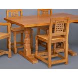 A ROBERT THOMPSON ADZED OAK REFECTORY TABLE of rounded oblong form, raised on faceted turned and