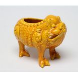 A LARGE BURMANTOFTS POTTERY TOAD SPOON WARMER, standing on three legs in an ochre glaze, impressed