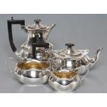 A FOUR PIECE TEA AND COFFEE SERVICE, maker T. Bishton, Birmingham 1918, of lobed oblong baluster
