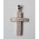 A DIAMOND CROSS PENDANT, the sixty eight small round brilliants point set to a slightly convex