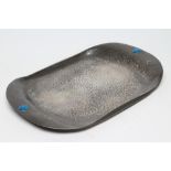 AN ARTS AND CRAFTS PEWTER TRAY, of plain D end oblong form with planished finish, each solid