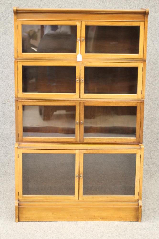 A MAHOGANY SECTIONAL BOOKCASE "The Oxford" by William Baker & Co. Ltd., the upper section with