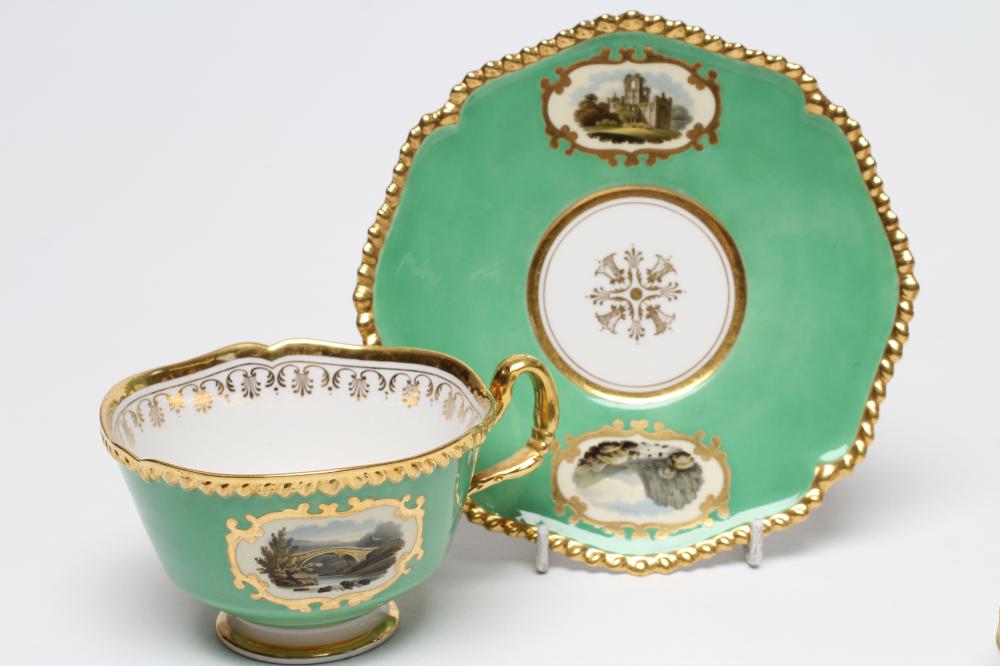 A FLIGHT, BARR & BARR PORCELAIN TEA CUP AND SAUCER painted with named vignette panels comprising " - Image 2 of 4