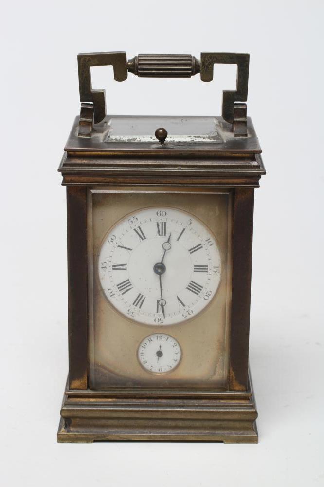 A BRASS CASED CARRIAGE CLOCK, the twin barrel movement with platform escapement and repeat mechanism
