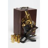 A J. SWIFT & SON LONDON MONOCULAR MICROSCOPE, early 20th century, in brass and black lacquer with