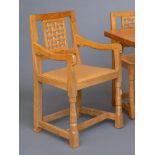 A SET OF EIGHT ROBERT THOMPSON OAK DINING CHAIRS, including two elbow chairs, of lattice back form