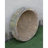 A SANDSTONE BOWL, of deep circular form with rough hewn edge, 30" x 8 1/2" (Est. plus 21% premium