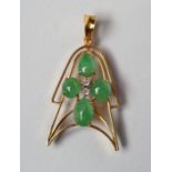 A MODERN PENDANT, the rounded open arrowhead claw set with four cabochon polished small jade beads