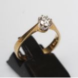 A SOLITAIRE DIAMOND RING, the round brilliant cut stone of approximately 0.5cts claw set to a