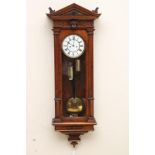 A WALNUT VIENNA TYPE WALL CLOCK, the eight day two train movement with anchor escapement striking on