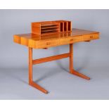 A GEORG PETERSENS MOBELFABRIK DANISH TEAK DESK of oblong form with three frieze drawers with