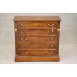 A WALNUT AND EBONISED SECRETAIRE CHEST, modern, of oblong form with stringing and gilt metal mounts,