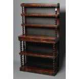 A VICTORIAN ROSEWOOD OPEN BOOKCASE of oblong graduated form with spiral twist and baluster turned