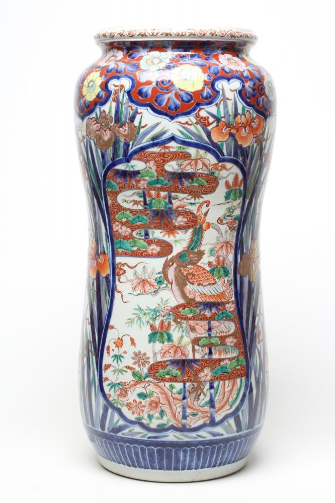 AN IMARI PORCELAIN STICK STAND of slightly waisted cylindrical form painted in typical palette