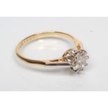 A SOLITAIRE DIAMOND RING, the round brilliant cut stone of approximately 0.70cts claw set to a plain