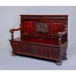 A RENASSANCE REVIVAL CARVED MAHOGANY BOX SETTLE, c.1900, the back with central panel crisply