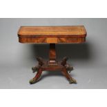 A REGENCY ROSEWOOD FOLDING TEA TABLE of rounded oblong form, the banded swivel top with perimeter
