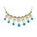 A TOPAZ AND DIAMOND NECKLACE, with nine round facet cut stones claw set in 18ct gold to fancy scroll