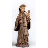 A CARVED WOOD AND PAINTED FIGURE OF ST ANTHONY OF PADUA, 17th century, modelled standing and with