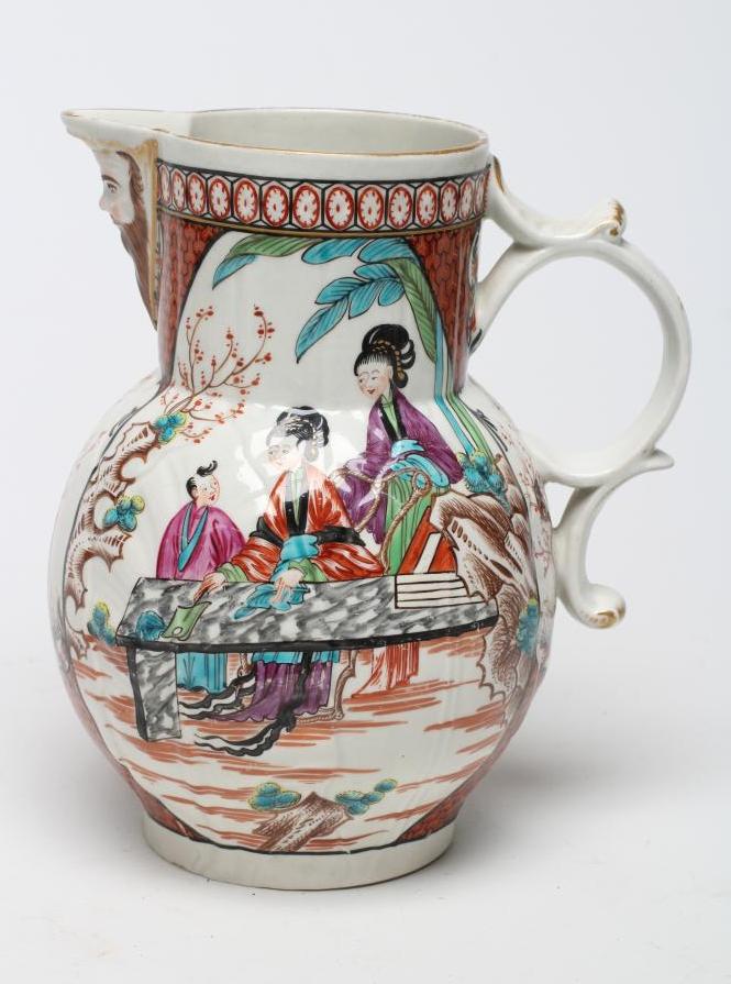 A FIRST PERIOD WORCESTER PORCELAIN CABBAGE LEAF MOULDED MASK JUG, c.1760, painted in polychrome