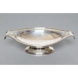 A LOW PEDESTAL OVAL DISH, maker Martin, Hall & Co., Sheffield 1922, with scroll pierced out-turned